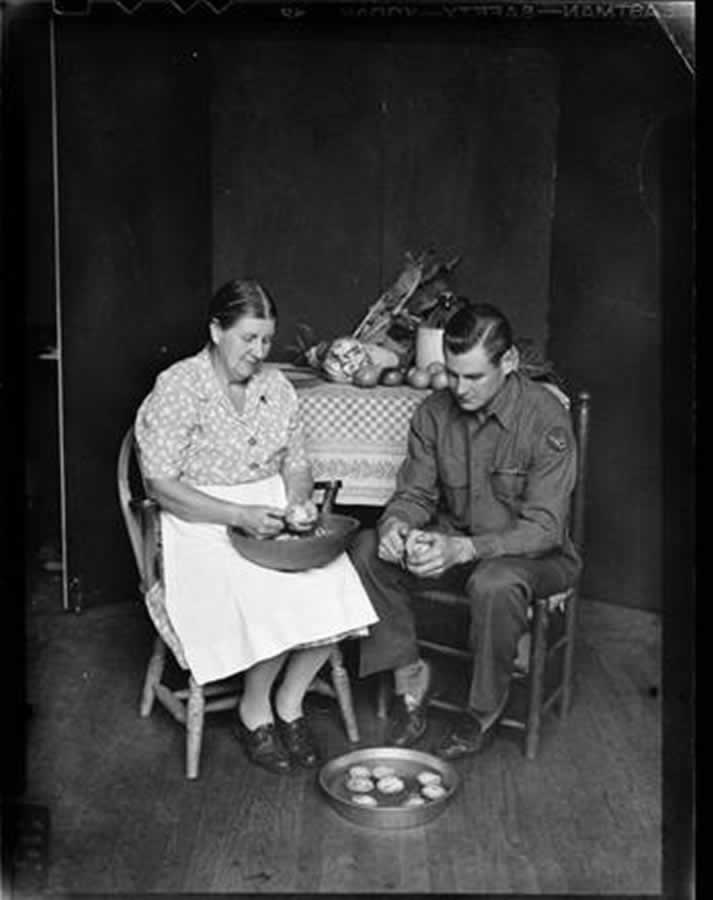 Black and White photograph - Richard and his Mother peeling potatoes